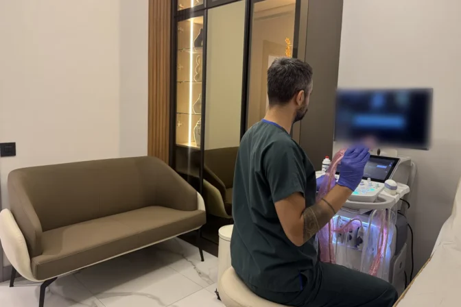 Op. Dr. Hüseyin Efe Akalın working with the ultrasound probe and screen